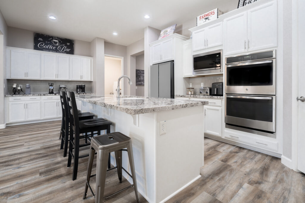 A kitchen island with coffee bar and renovated flooring. Residential Media & Marketing Photography by Darren Choate
